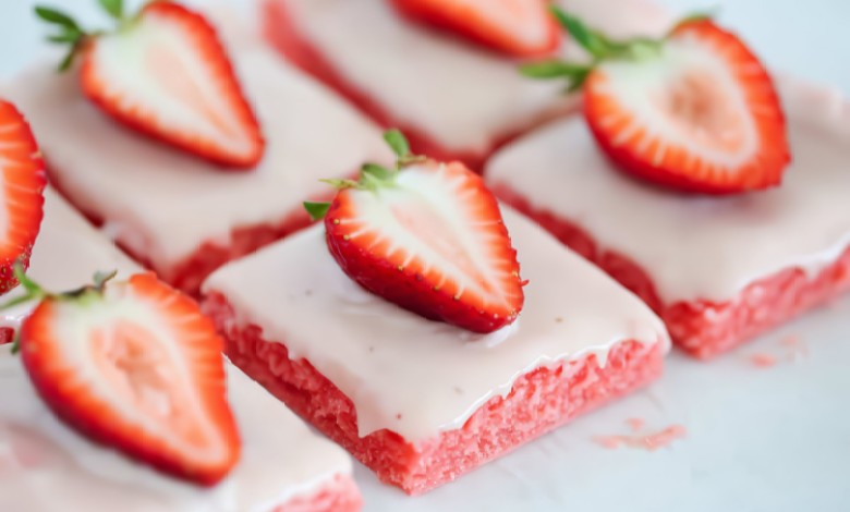 A plate of delicious strawberry brownies, topped with fresh strawberries. A plate of delicious strawberry brownies, topped with fresh strawberries.