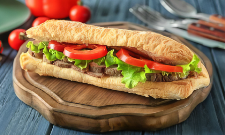 Steak Sandwich with sliced steak, cheese, and vegetables Steak Sandwich with sliced steak, cheese, and vegetables