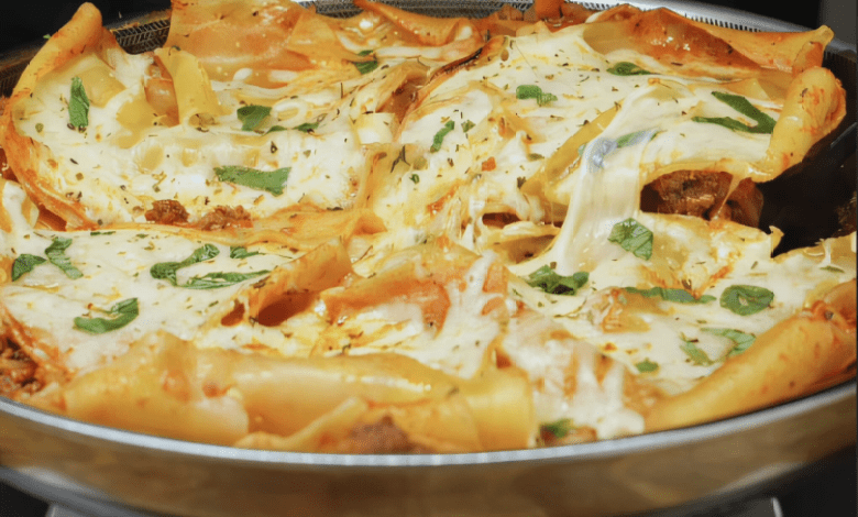 A delicious serving of One Pan Lasagna with melted cheese and fresh basil leaves. A delicious serving of One Pan Lasagna with melted cheese and fresh basil leaves.