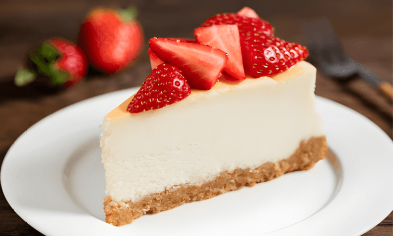 Strawberry Cheesecake- A slice of strawberry cheesecake topped with fresh strawberries Strawberry Cheesecake- A slice of strawberry cheesecake topped with fresh strawberries
