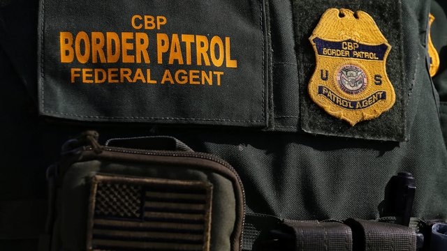 Close-up of the CBP Federal Agent insignia, symbolizing the dedication and authority of U.S. Customs and Border Protection officers. Close-up of the CBP Federal Agent insignia, symbolizing the dedication and authority of U.S. Customs and Border Protection officers.