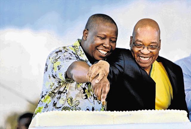 Julius Malema and Jacob Zuma share a celebratory moment, slicing cake at a past political gathering, symbolizing their fleeting unity. Julius Malema and Jacob Zuma share a celebratory moment, slicing cake at a past political gathering, symbolizing their fleeting unity.