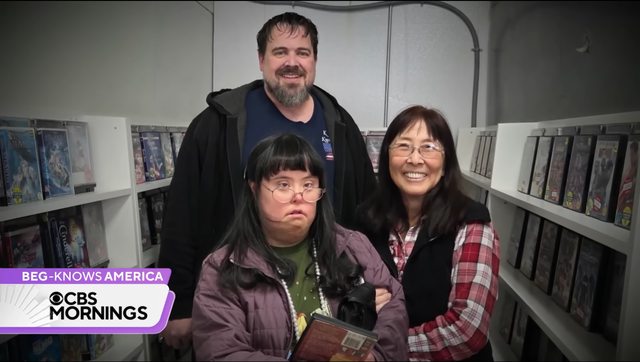 Caption: Christina Cavanaugh, joined by David Craning and her mom, Tony, cherishes her daily ritual at "Christina’s Corner" DVD shelves in Craning’s Pocatello, Idaho, store. (Credit: CBS News) Caption: Christina Cavanaugh, joined by David Craning and her mom, Tony, cherishes her daily ritual at "Christina’s Corner" DVD shelves in Craning’s Pocatello, Idaho, store. (Credit: CBS News)