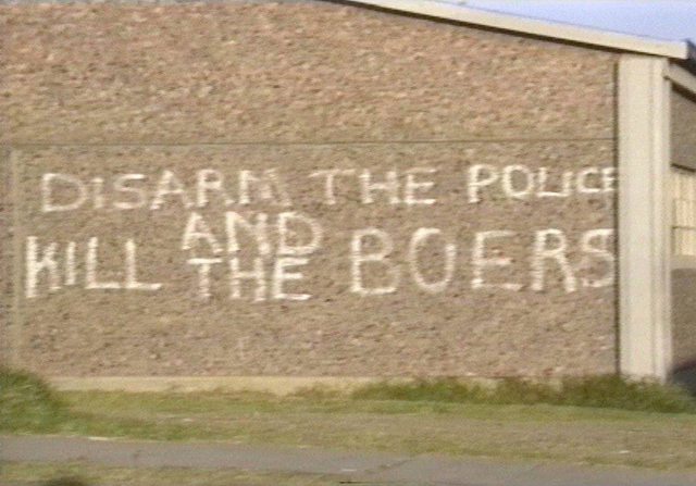 Graffiti stating: "Disarm the police and kille the boers!" at an unrelated location. Graffiti stating: "Disarm the police and kille the boers!" at an unrelated location.