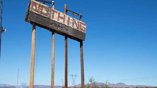 A barren "NOTHING" sign in the Arizona desert mirrors the void left by the U.S. State Department’s missing South Africa relations page, signaling strained ties. A barren "NOTHING" sign in the Arizona desert mirrors the void left by the U.S. State Department’s missing South Africa relations page, signaling strained ties.