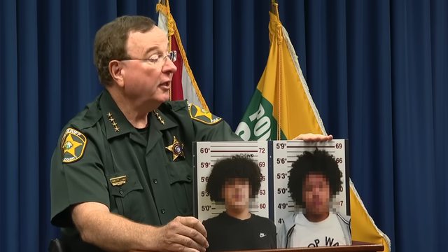 Sheriff Grady Judd displays images of teens Isaiah Reyes, 14, and Carder Martin, 15, arrested for swatting a 12-year-old in Polk County, FL, after false emergency calls sparked by online gaming disputes. Sheriff Grady Judd displays images of teens Isaiah Reyes, 14, and Carder Martin, 15, arrested for swatting a 12-year-old in Polk County, FL, after false emergency calls sparked by online gaming disputes.