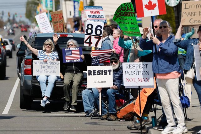 Protestor holds up sign with the code 86 47. Photo by Karen Ducey at The Seattle Times. Protestor holds up sign with the code 86 47. Photo by Karen Ducey at The Seattle Times.