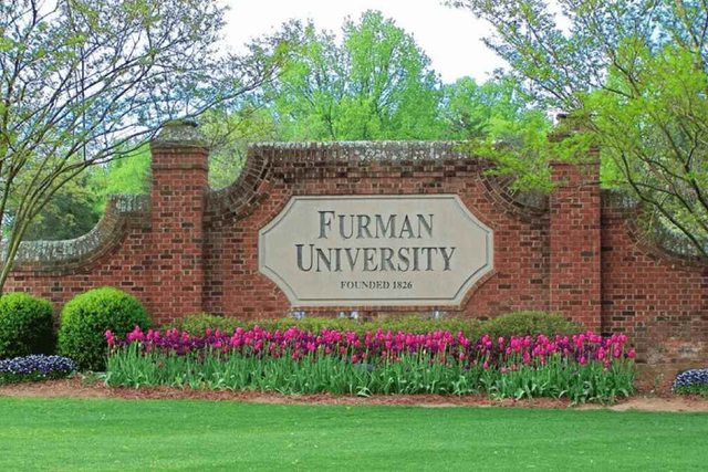 Furman University's name on sign on a wall. Furman University's name on sign on a wall.