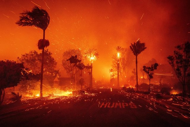 Fire engulfing a neighborhood during the Los Angeles County wildfires. Fire engulfing a neighborhood during the Los Angeles County wildfires.