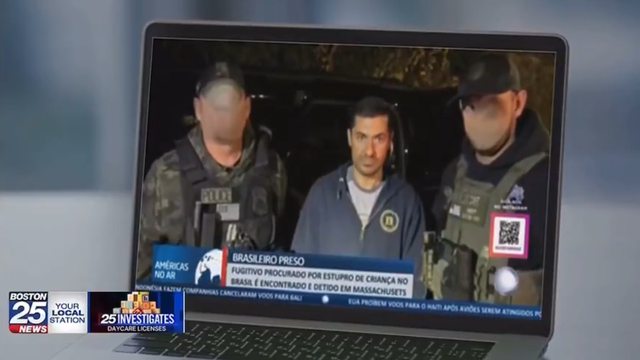 The fugitive arrested between two law enforcement officers. The fugitive arrested between two law enforcement officers.