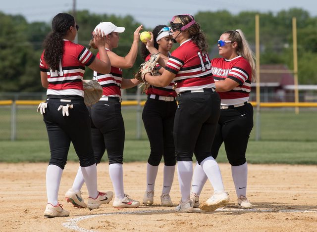 High school softball players compete in a championship game. (File Photo) High school softball players compete in a championship game. (File Photo)