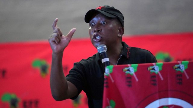 Julius Malema, South Africa's fiery opposition leader, faces a UK visa ban, deemed "non-conducive to the public good," sparking controversy over political motives. Julius Malema, South Africa's fiery opposition leader, faces a UK visa ban, deemed "non-conducive to the public good," sparking controversy over political motives.