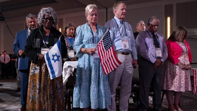 Evangelical Christians hold U.S. and Israeli flags while praying at the 2023 CUFI "Night to Honor Israel" summit in Arlington, Va. (Jacquelyn Martin, AP) Evangelical Christians hold U.S. and Israeli flags while praying at the 2023 CUFI "Night to Honor Israel" summit in Arlington, Va. (Jacquelyn Martin, AP)