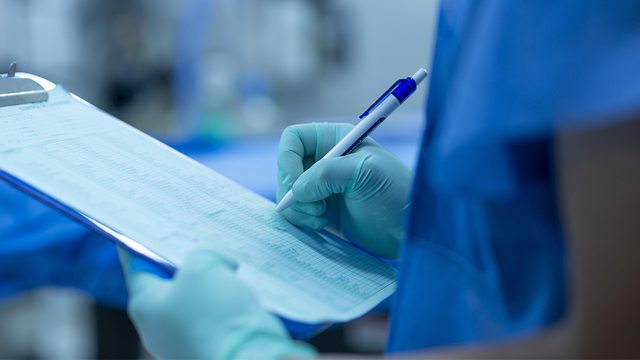 Health practitioner documenting records. Health practitioner documenting records.