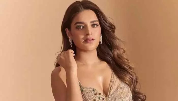 Nidhhi Agerwal's Hot Photoshoot: Bold Poses & Controversy Stir Social Media Nidhhi Agerwal's Hot Photoshoot: Bold Poses & Controversy Stir Social Media