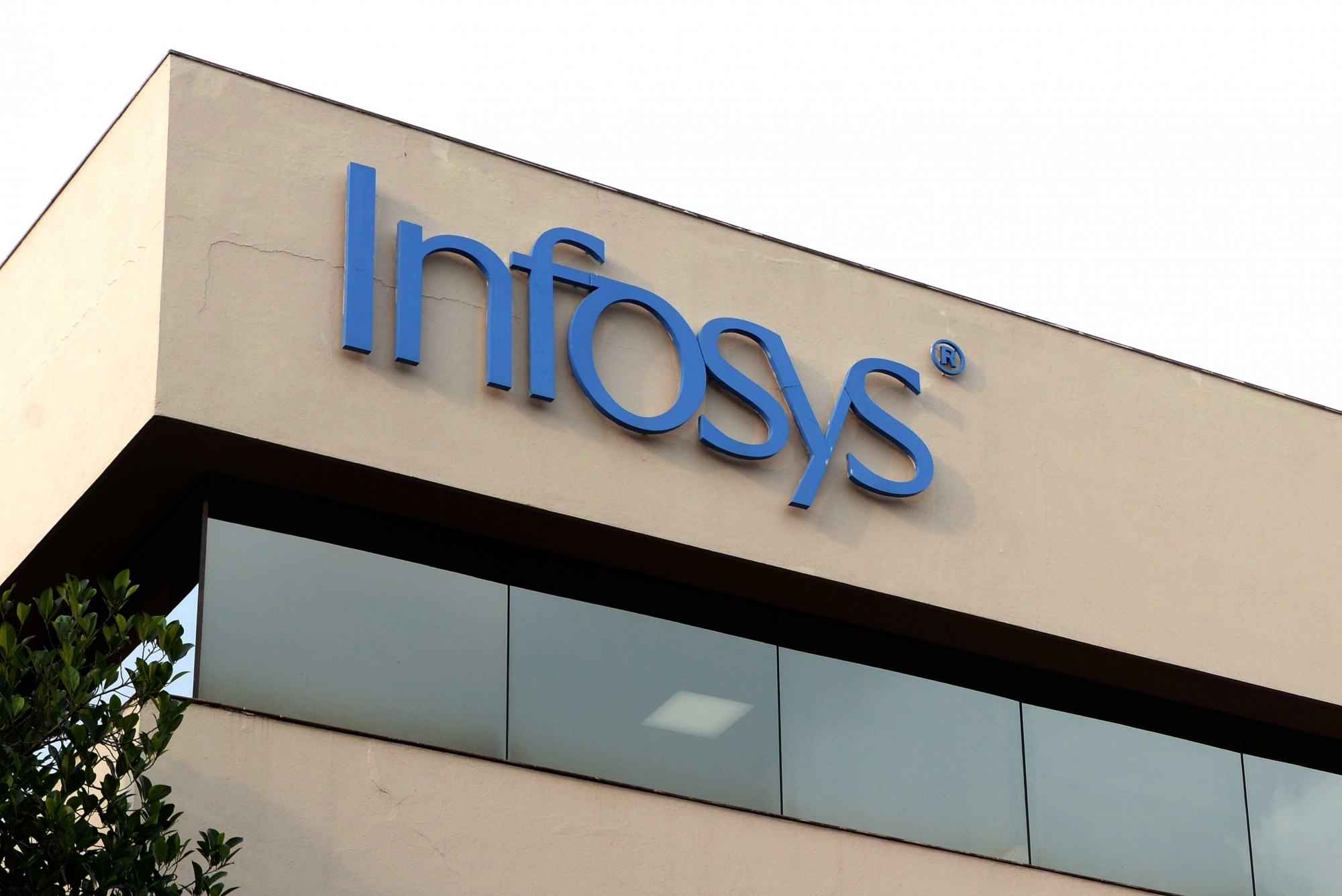 Infosys Pune office building exterior during daytime Infosys Pune office building exterior during daytime