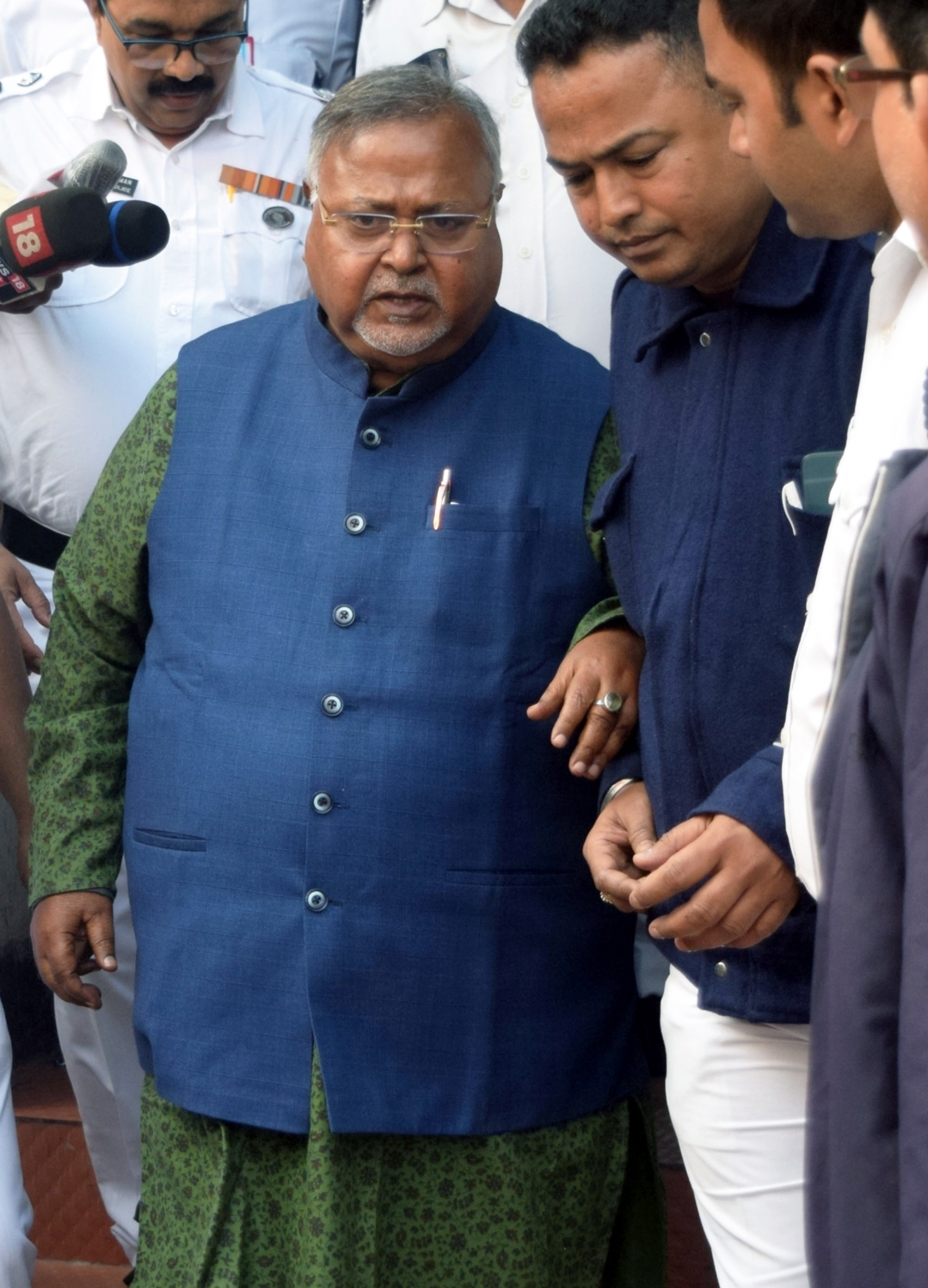 ED officials outside former education minister Partha Chatterjee's residence during raid ED officials outside former education minister Partha Chatterjee's residence during raid