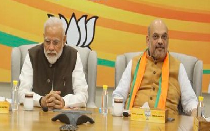 PM Modi and Amit Shah discussing governance and service milestones PM Modi and Amit Shah discussing governance and service milestones