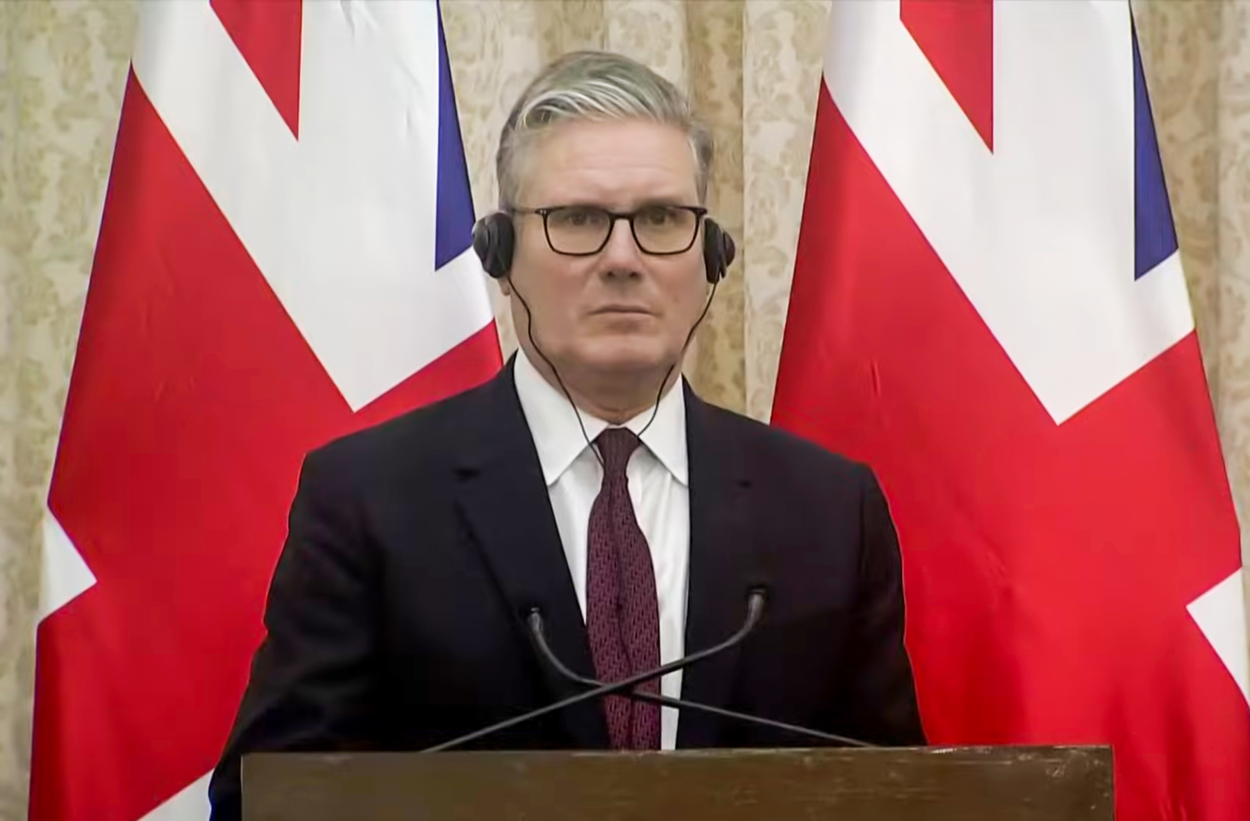 UK Prime Minister Keir Starmer looking serious during a press conference UK Prime Minister Keir Starmer looking serious during a press conference
