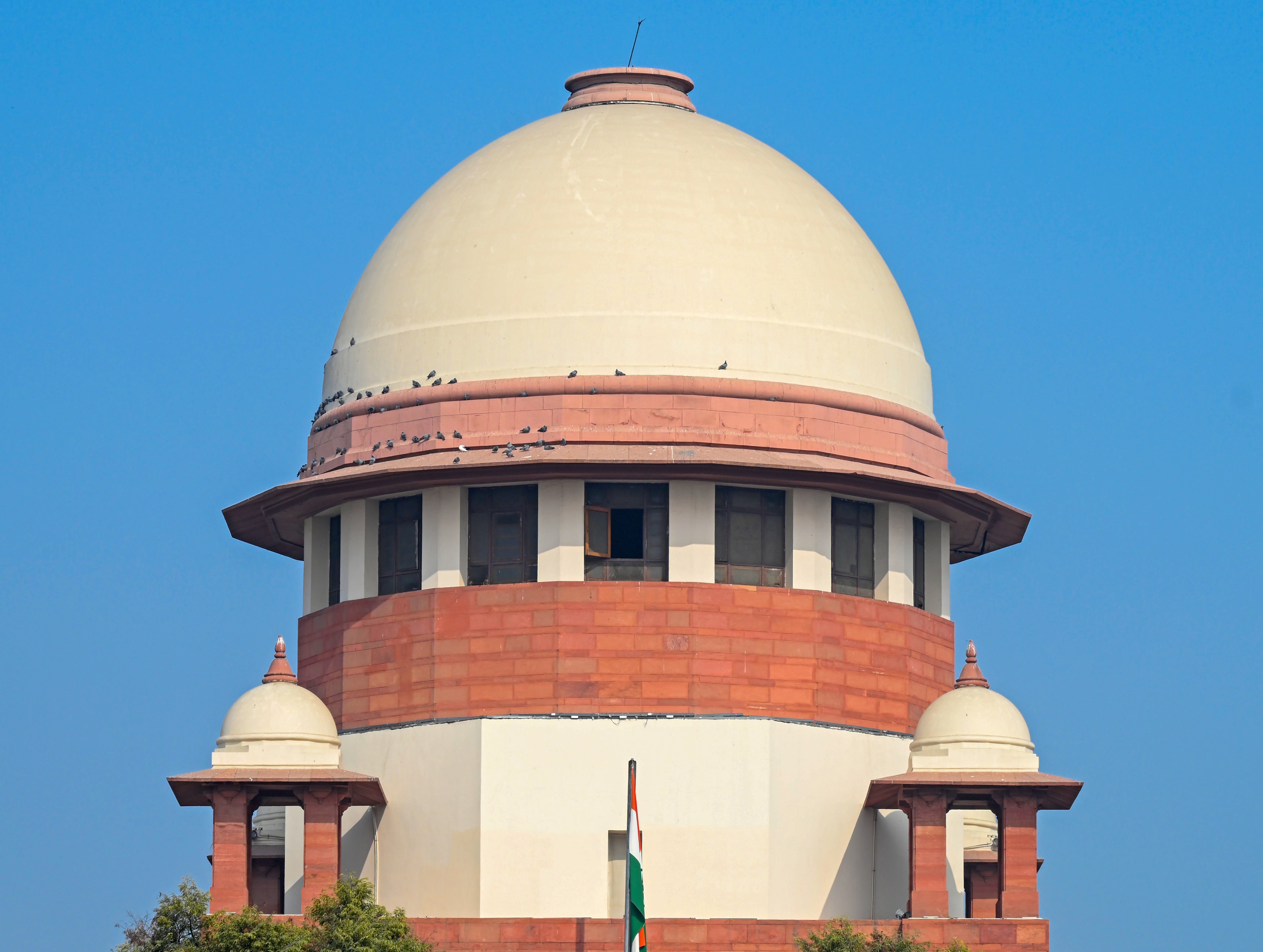 Supreme Court of India building with legal scales symbolizing the Adani Jaiprakash Associates case Supreme Court of India building with legal scales symbolizing the Adani Jaiprakash Associates case