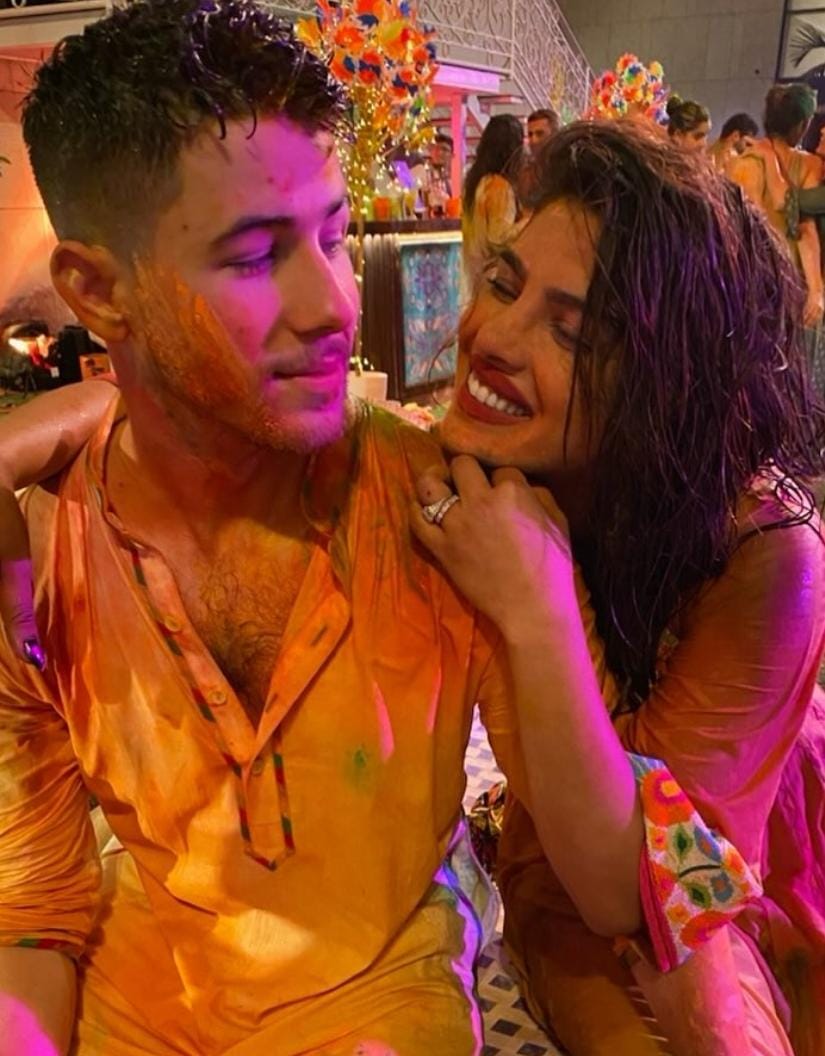 Nick Jonas and Priyanka Chopra covered in colors during Holi celebration Nick Jonas and Priyanka Chopra covered in colors during Holi celebration