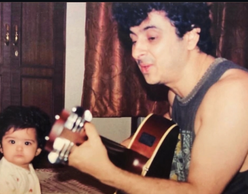 Palash Sen playing guitar with baby daughter Kyna as his first audience Palash Sen playing guitar with baby daughter Kyna as his first audience