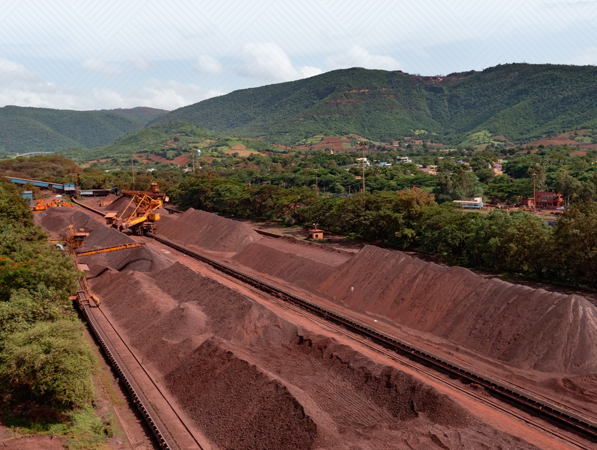 NMDC iron ore mining site showing heavy machinery and operations NMDC iron ore mining site showing heavy machinery and operations