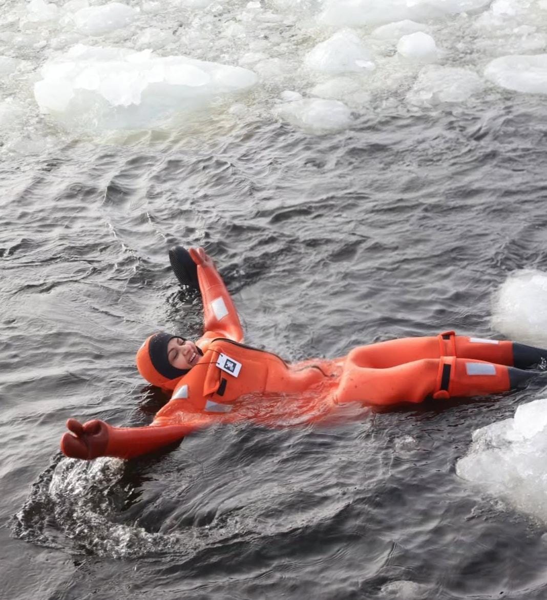 Bhagyashree floating in Arctic waters wearing orange survival suit during Finland swim Bhagyashree floating in Arctic waters wearing orange survival suit during Finland swim