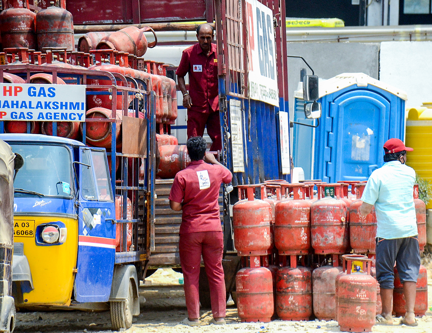 Government officials conducting LPG cylinder raid checking for black marketing Government officials conducting LPG cylinder raid checking for black marketing