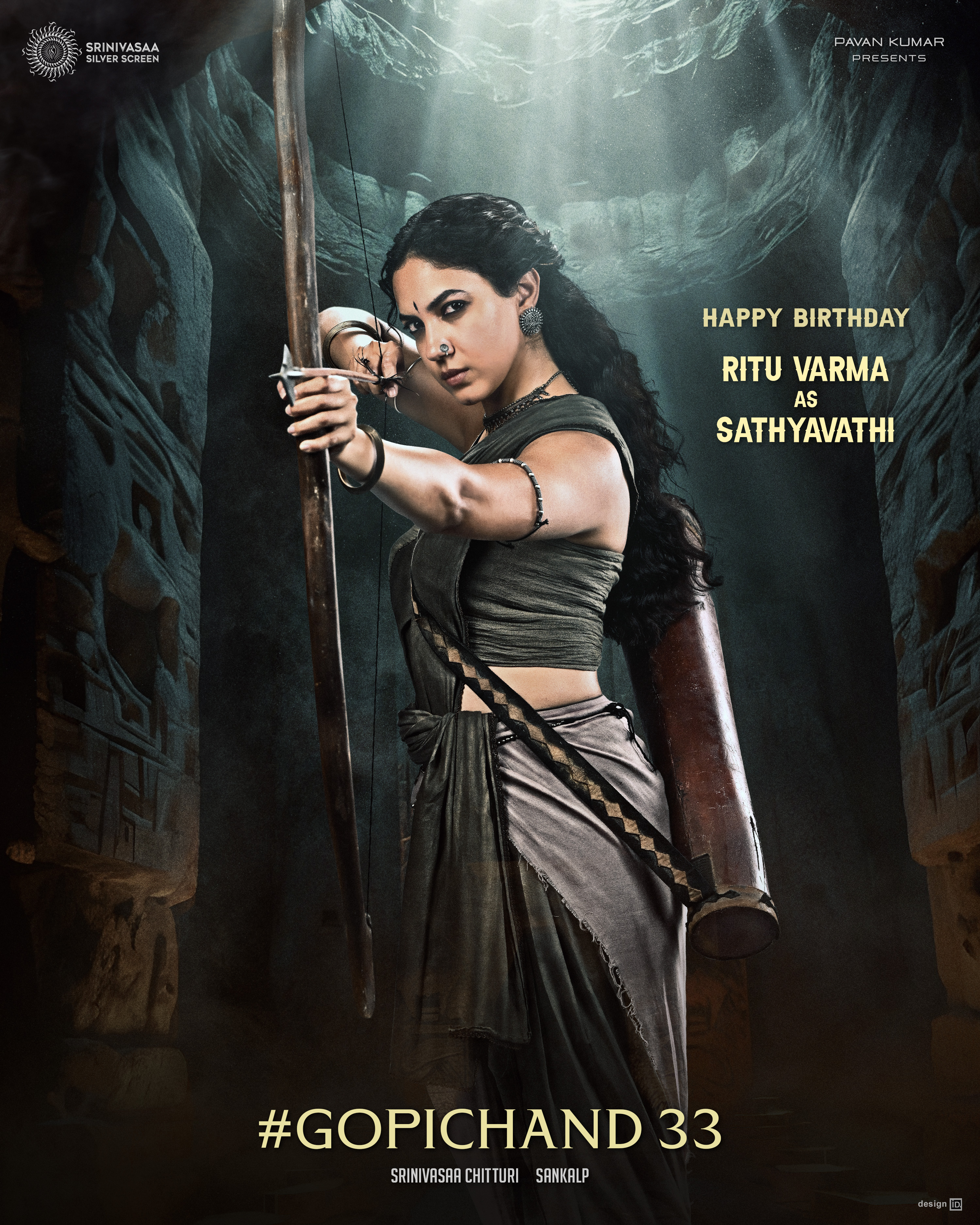 Ritu Varma as Sathyavathi aiming a bow and arrow in Gopichand33 first look poster Ritu Varma as Sathyavathi aiming a bow and arrow in Gopichand33 first look poster