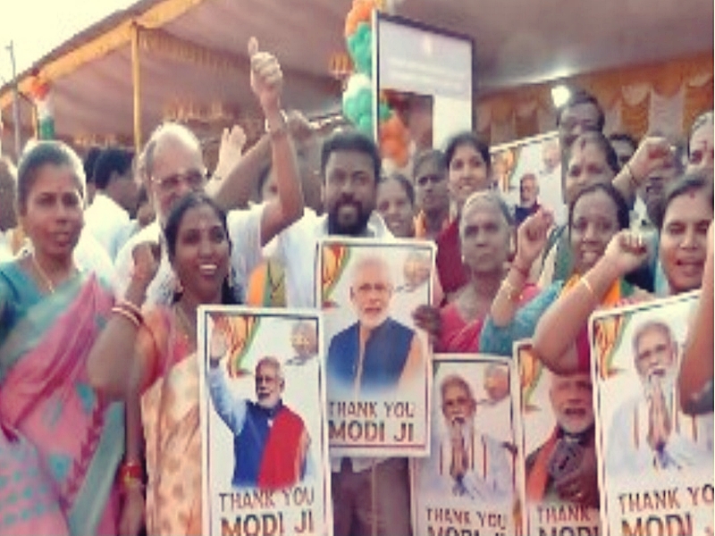 Coimbatore residents holding posters of PM Modi at Podanur railway junction Coimbatore residents holding posters of PM Modi at Podanur railway junction