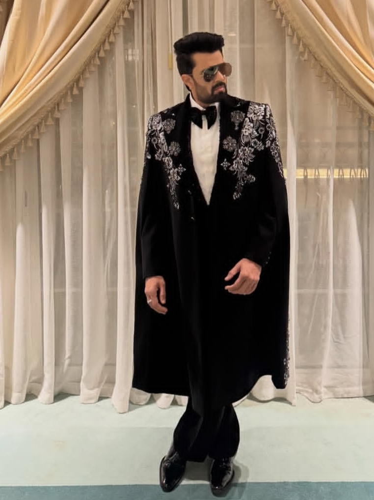 Maniesh Paul in black suit walking in hotel corridor joking about mental health Maniesh Paul in black suit walking in hotel corridor joking about mental health