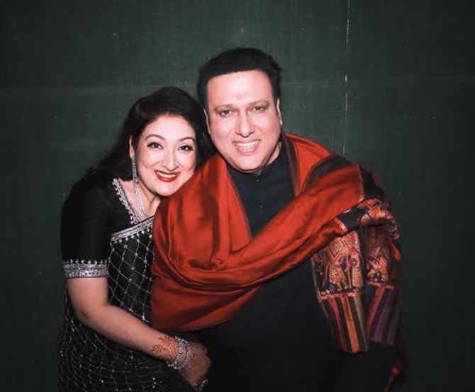 Govinda and wife Sunita smiling together Govinda and wife Sunita smiling together