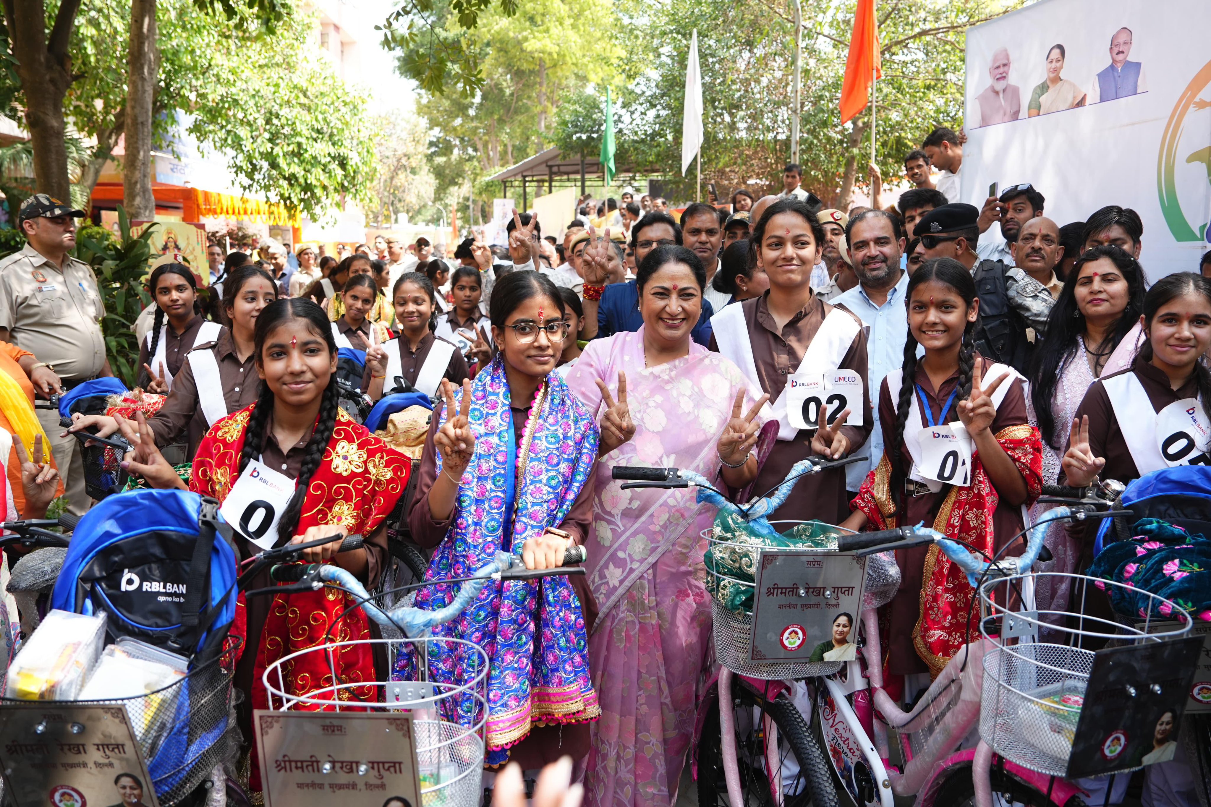 Delhi Chief Minister distributing bicycles to schoolgirls under Vidya Vahini initiative Delhi Chief Minister distributing bicycles to schoolgirls under Vidya Vahini initiative
