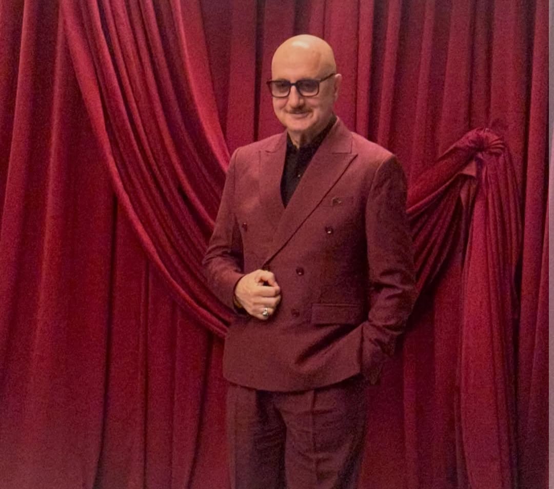 Anupam Kher wearing formal clothes and looking confident at 71 Anupam Kher wearing formal clothes and looking confident at 71