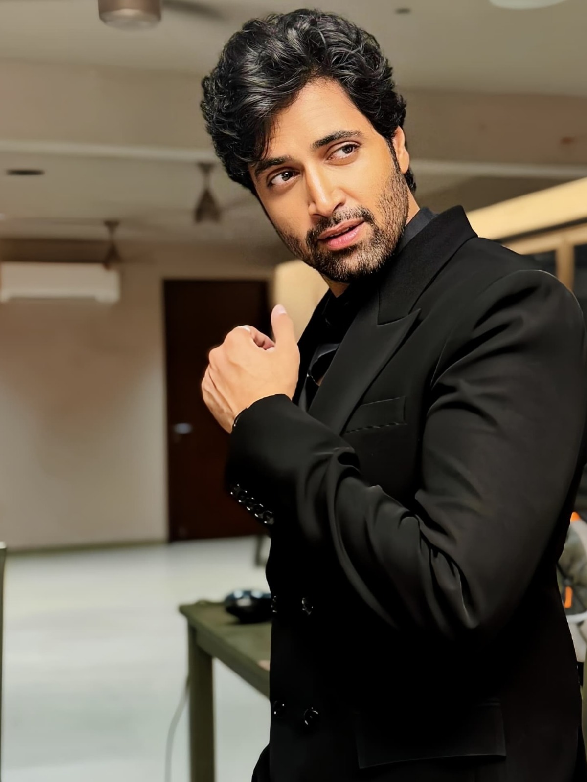 Adivi Sesh discussing bilingual film shooting logistics during an interview Adivi Sesh discussing bilingual film shooting logistics during an interview