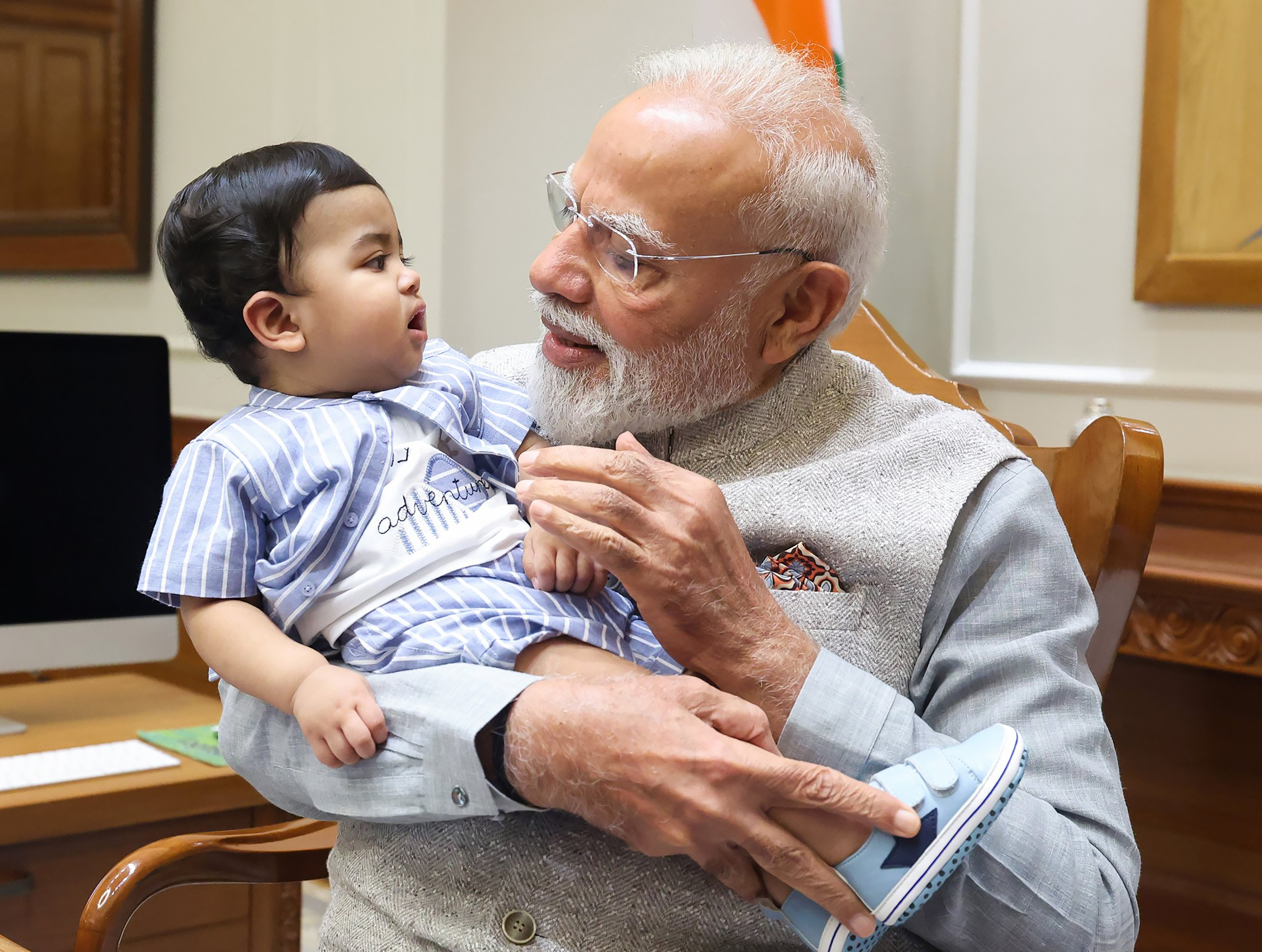 PM Narendra Modi with Krishnakumar family including young Omy PM Narendra Modi with Krishnakumar family including young Omy