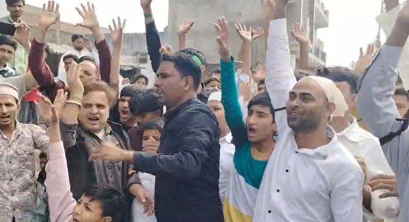 Shia community members wearing black armbands during Eid prayers in Sambhal Shia community members wearing black armbands during Eid prayers in Sambhal
