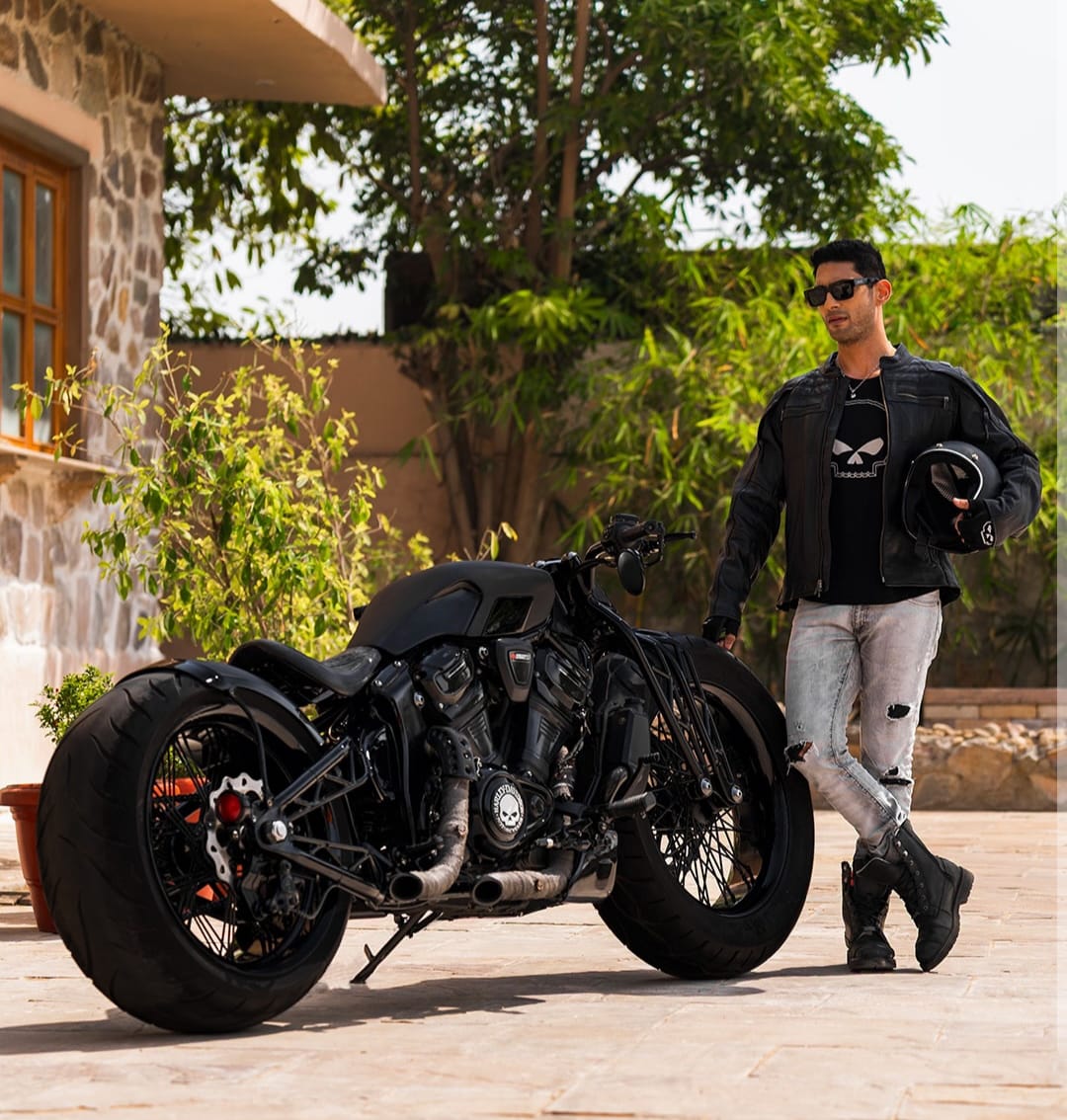 Prateik Smita Patil posing with his custom black motorcycle Kaal Prateik Smita Patil posing with his custom black motorcycle Kaal