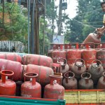 Indian family using LPG cylinder for cooking with government subsidy Indian family using LPG cylinder for cooking with government subsidy