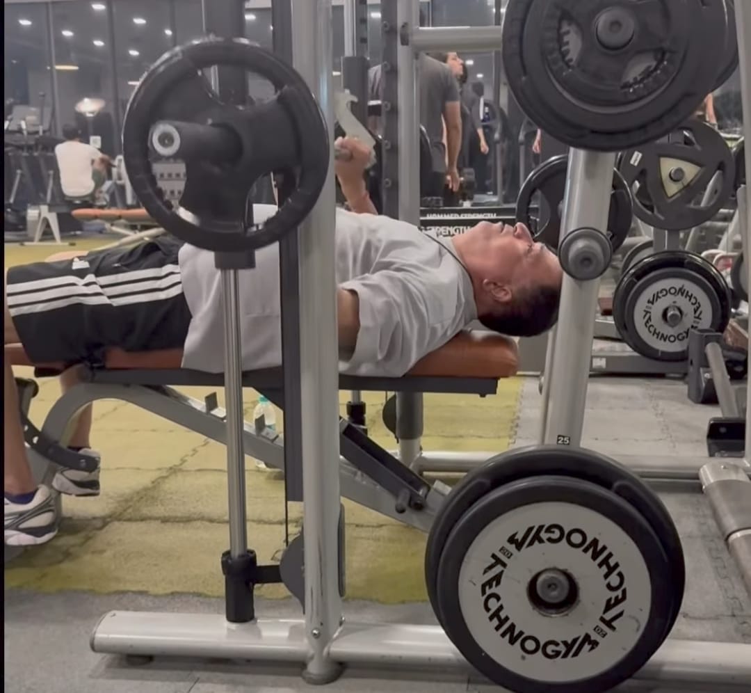Sham Kaushal performing bench press in gym at age 70 Sham Kaushal performing bench press in gym at age 70