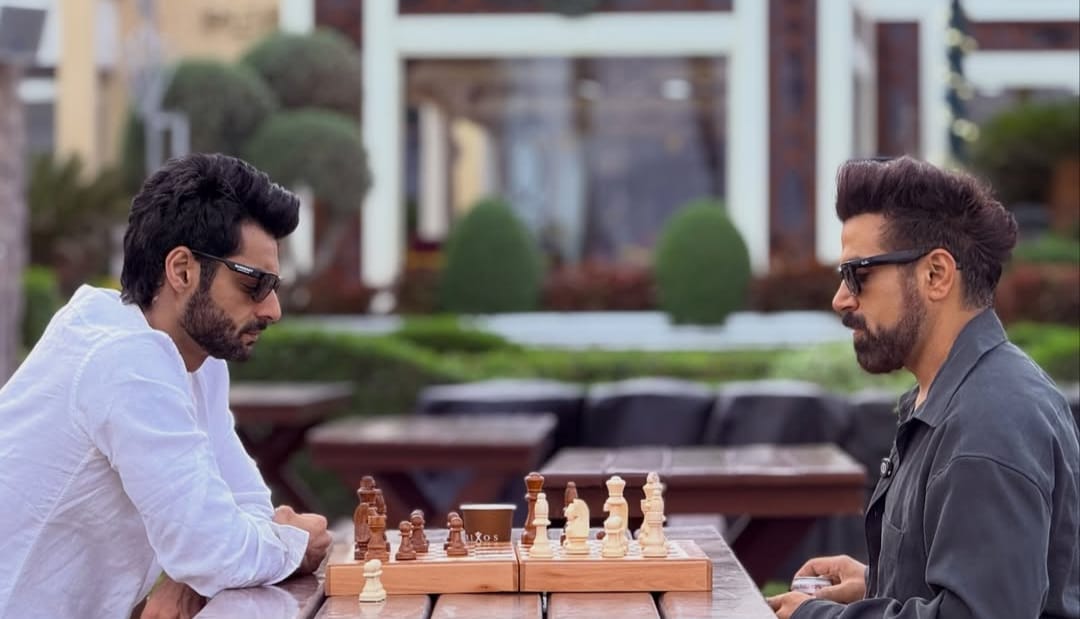 Karan Wahi and Rithvikk Dhanjani playing chess seriously outdoors Karan Wahi and Rithvikk Dhanjani playing chess seriously outdoors