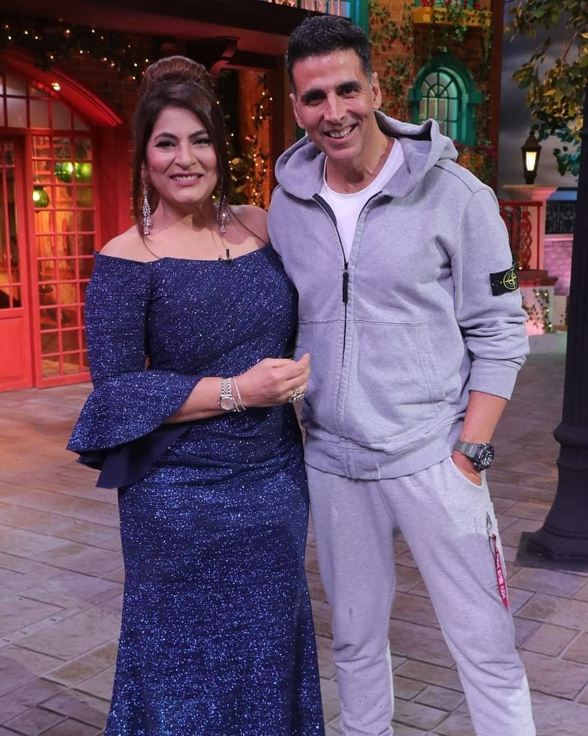 Akshay Kumar and Archana Puran Singh laughing together on Wheel of Fortune set Akshay Kumar and Archana Puran Singh laughing together on Wheel of Fortune set