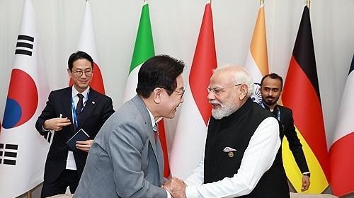 PM Modi and South Korean President Lee shaking hands at bilateral summit PM Modi and South Korean President Lee shaking hands at bilateral summit