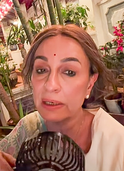 Soni Razdan using a hand fan while filming in hot Mumbai weather Soni Razdan using a hand fan while filming in hot Mumbai weather