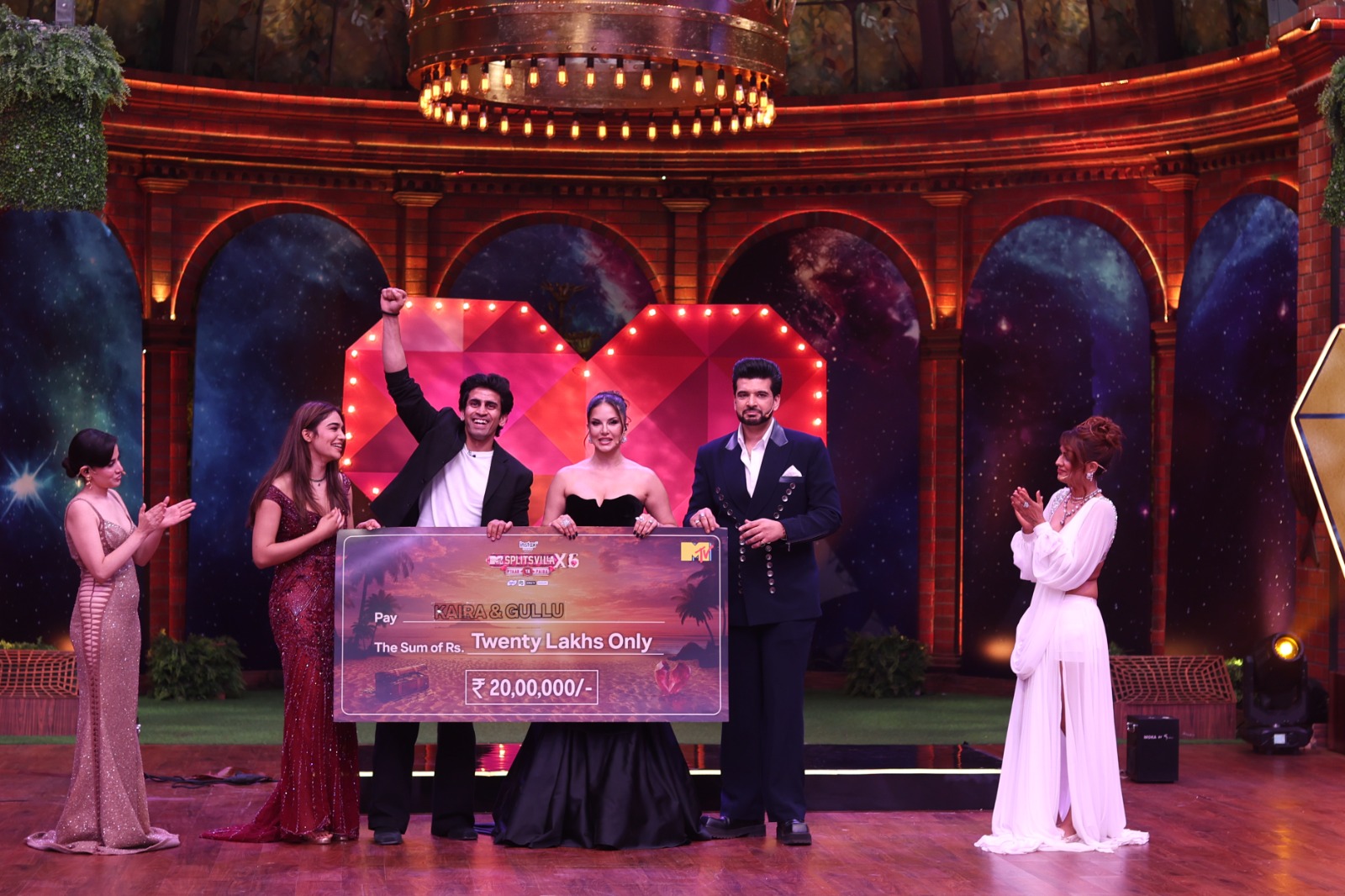 Splitsvilla X6 winners Kushal Tanwar and Kaira Anu holding trophy Splitsvilla X6 winners Kushal Tanwar and Kaira Anu holding trophy