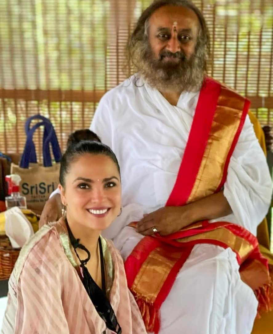 Lara Dutta sits beside Gurudev Sri Sri Ravi Shankar in traditional attire, smiling on his birthday Lara Dutta sits beside Gurudev Sri Sri Ravi Shankar in traditional attire, smiling on his birthday