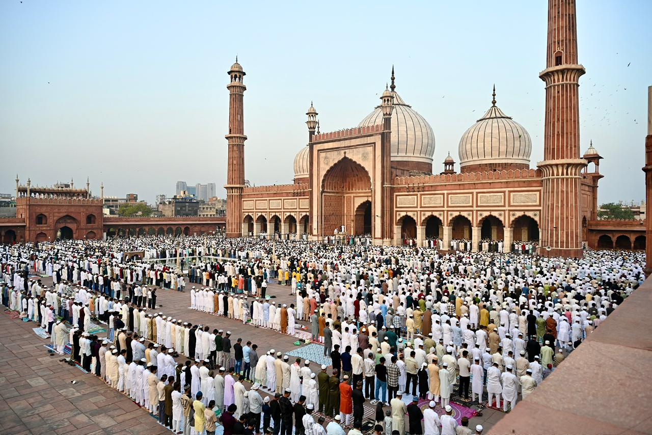 Eid al-Adha prayers at a mosque with devotees in traditional attire Eid al-Adha prayers at a mosque with devotees in traditional attire