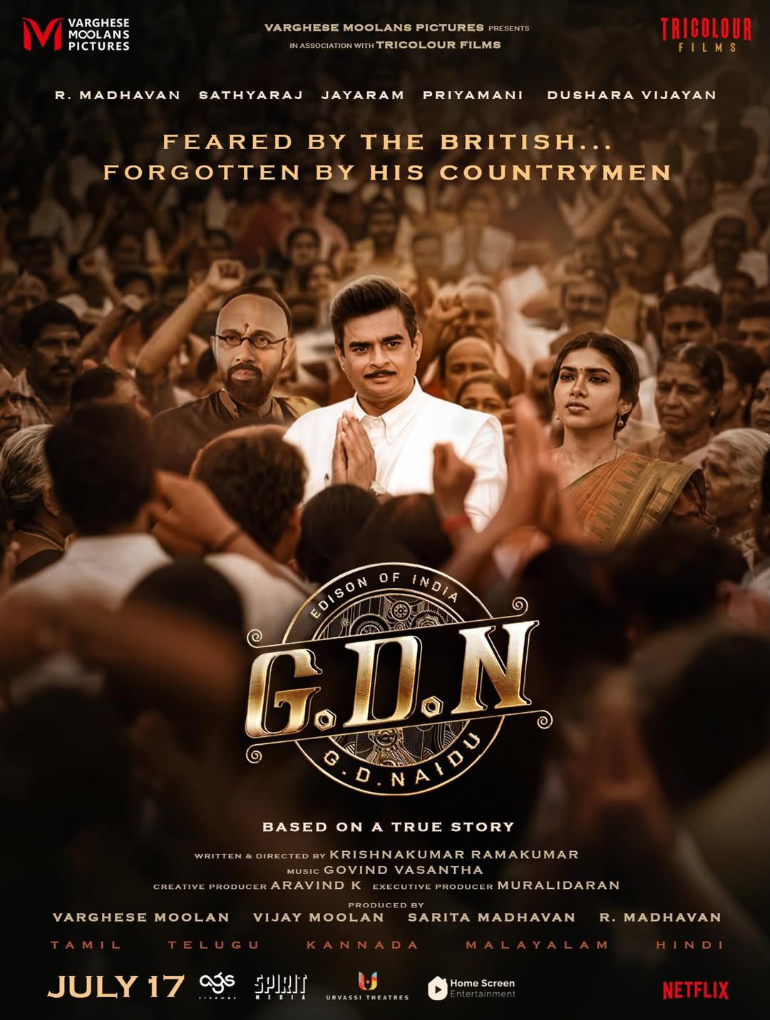 R. Madhavan G.D.N. poster standing amid crowd R. Madhavan G.D.N. poster standing amid crowd