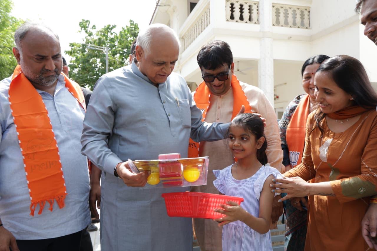 Gujarat CM at toy collection drive with donated toys for needy children Gujarat CM at toy collection drive with donated toys for needy children